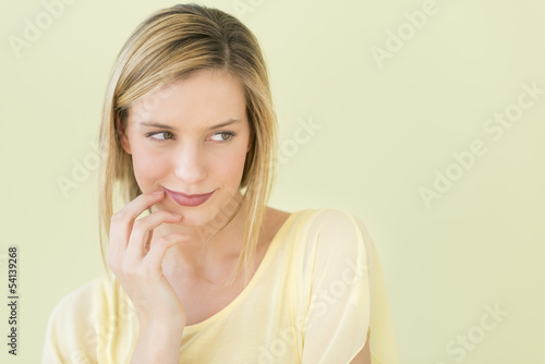 Woman Looking Away Against Green Background