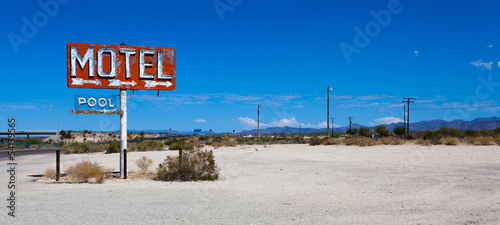 A vintage neon motel sign in the desert