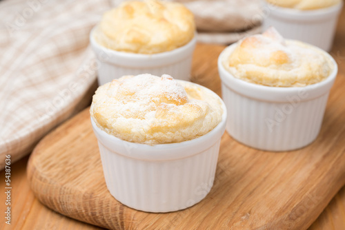 peach souffle in the portioned form on a wooden board