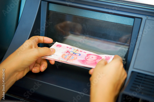 Chinese yuan issuing by ATM on hand
