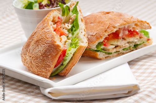 ciabatta panini sandwich with chicken and tomato