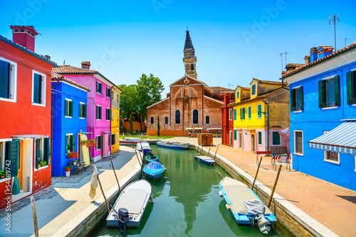 Venice landmark, Burano canal, houses, church and boats, Italy