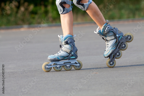 roller skates on beautiful girl's feet