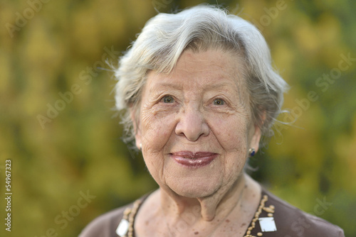 Friendly Looking Senior Woman in Her Garden 2