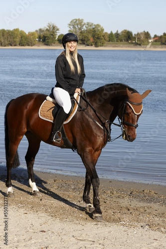 Horse and rider at riverside