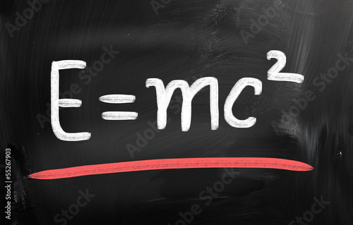 E=mc2 handwritten with chalk on a blackboard