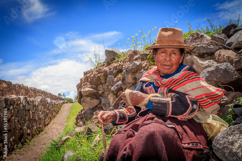 Peruvian Indian Woman in Traditional Dress Weaving