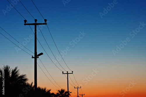 Electric power lines against a dawn sky