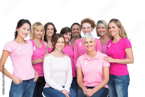 Cheerful pretty women posing and wearing pink for breast cancer