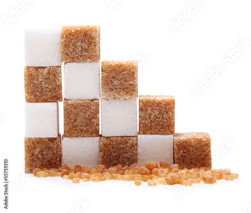 Brown and white cane sugar cubes isolated.