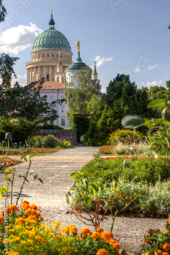 Dome and old town hall in Potsdam behind a flowered park