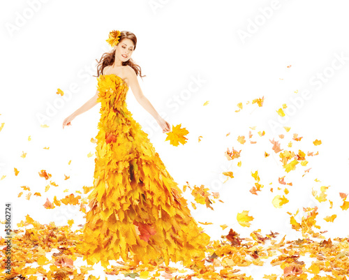 Autumn woman in yellow dress of maple leaves