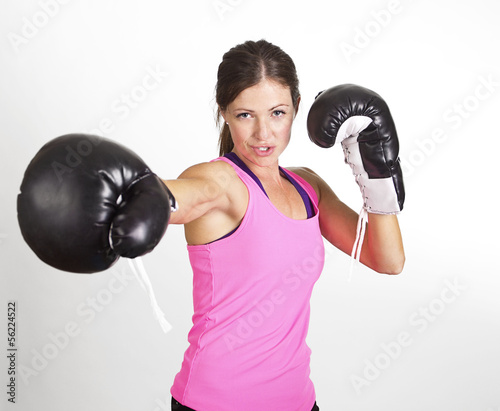 Woman boxing at a gym. Strong, fit woman in action