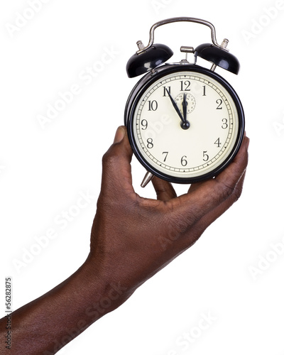 Man holding alarm clock isolated on white