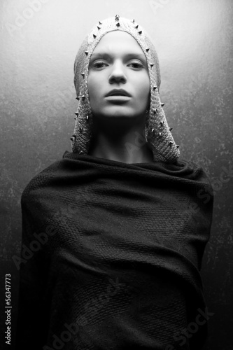 Art-fashion portrait of glamorous queen-warrior in vintage cape