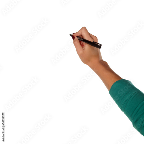 female hand holds a pen and write in the blank