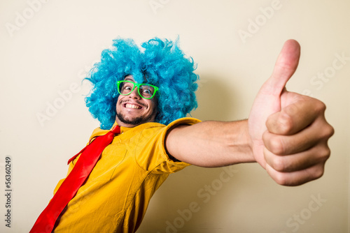 crazy funny young man with blue wig