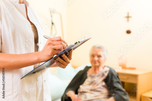 Young nurse and female senior in nursing home