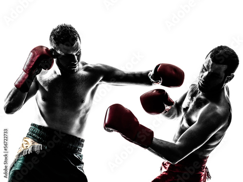 two men exercising thai boxing silhouette