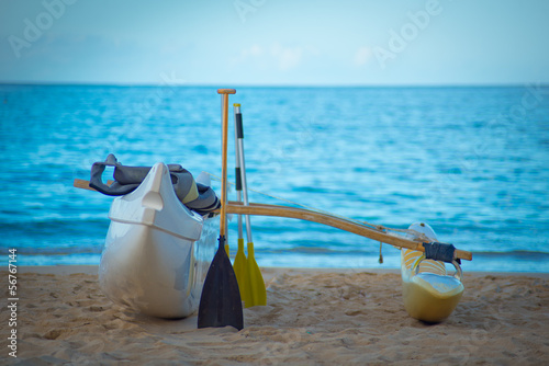 Canoe with outrigger on sand