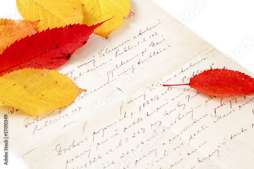 handwritten letter with autumn leaves