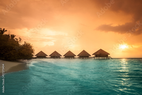 Over water bungalows with steps into amazing green lagoon