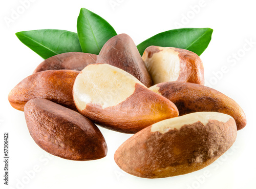 Brazil nuts with leafs isolated on white background