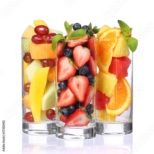 Fruit cocktails isolated. Fresh pieces of fruit in glasses