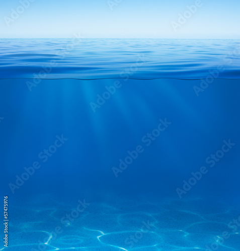 sea or ocean water surface with underwater split by waterline