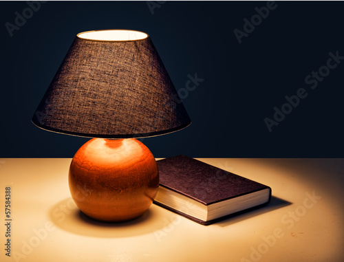 Bedtime reading - lamp with book at night