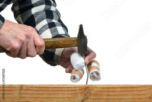 a handyman awkward trying to hammer a nail