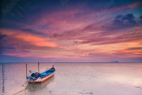 A parked boat at sunset in transportation concept