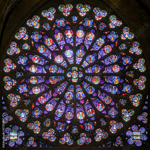 Rose stained glass window in cathedral of Notre Dame, Paris, France