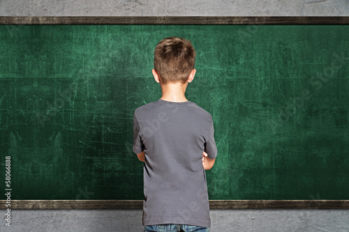 Child in front of empty Blackboard
