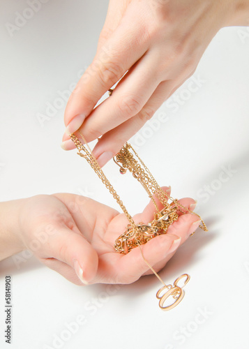 Gold ornaments in a hand
