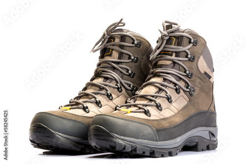 A pair of new hiking boots on white background