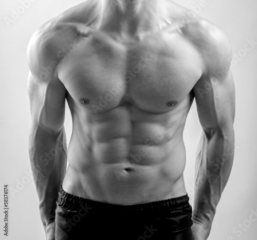 Close up on perfect abs. Strong bodybuilder with six pack