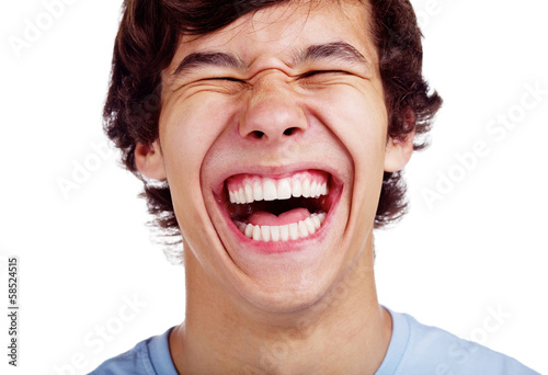 Happy teenage laugh closeup over white