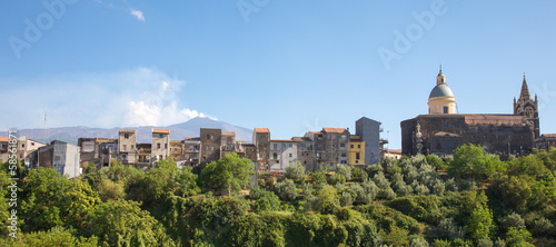 Typical village in Sicily with Etna volcano in the background