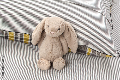 stuffed animal on cozy bed