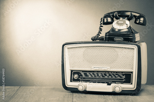 Vintage old radio and telephone sepia photo