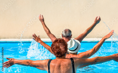 Active seniors getting a workout at the swimming pool