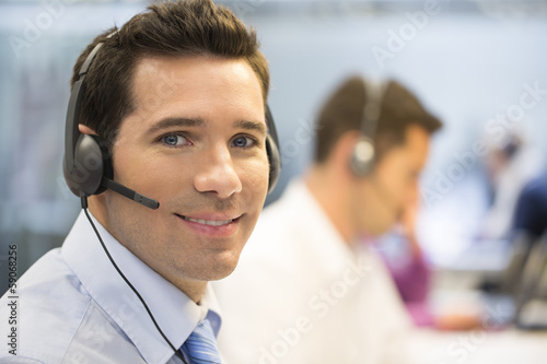 Businessman in the office on the phone with headset