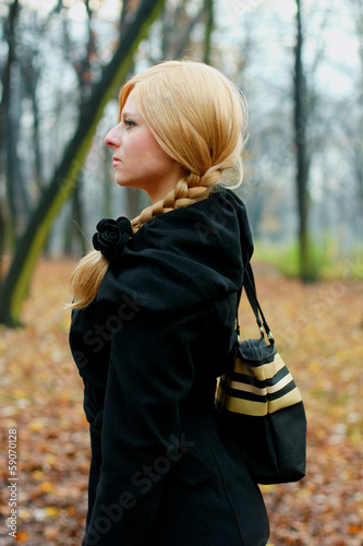 Portrait of blond in black coat