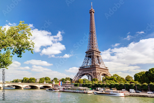 Eiffel tower in Paris, France. Panorama of Seine River in summer.