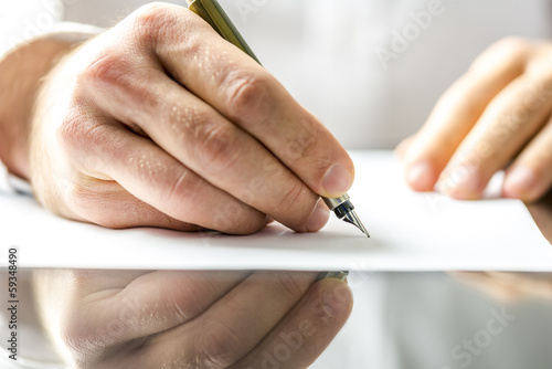 Man writing on a blank paper