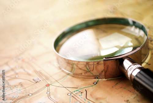 Magnifying glass lying on a map