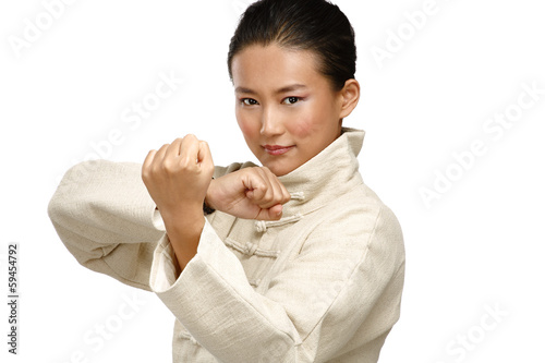 Beautiful asian woman make kung fu gesture