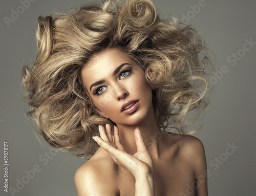 Beautiful blond woman with curly long hair