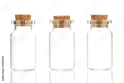 Empty little bottles with cork stopper isolated on white